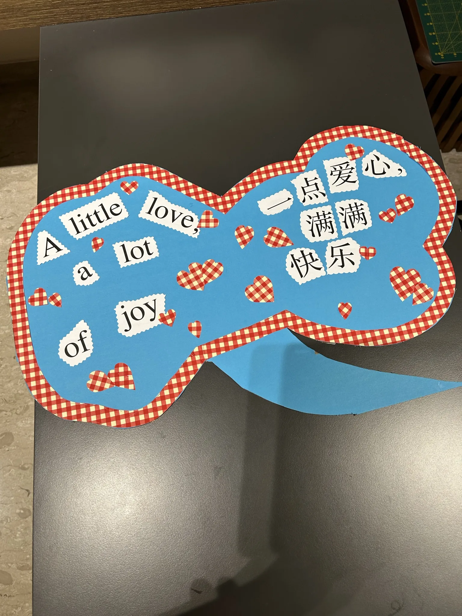 "A little love, a lot of joy" bilingual prop