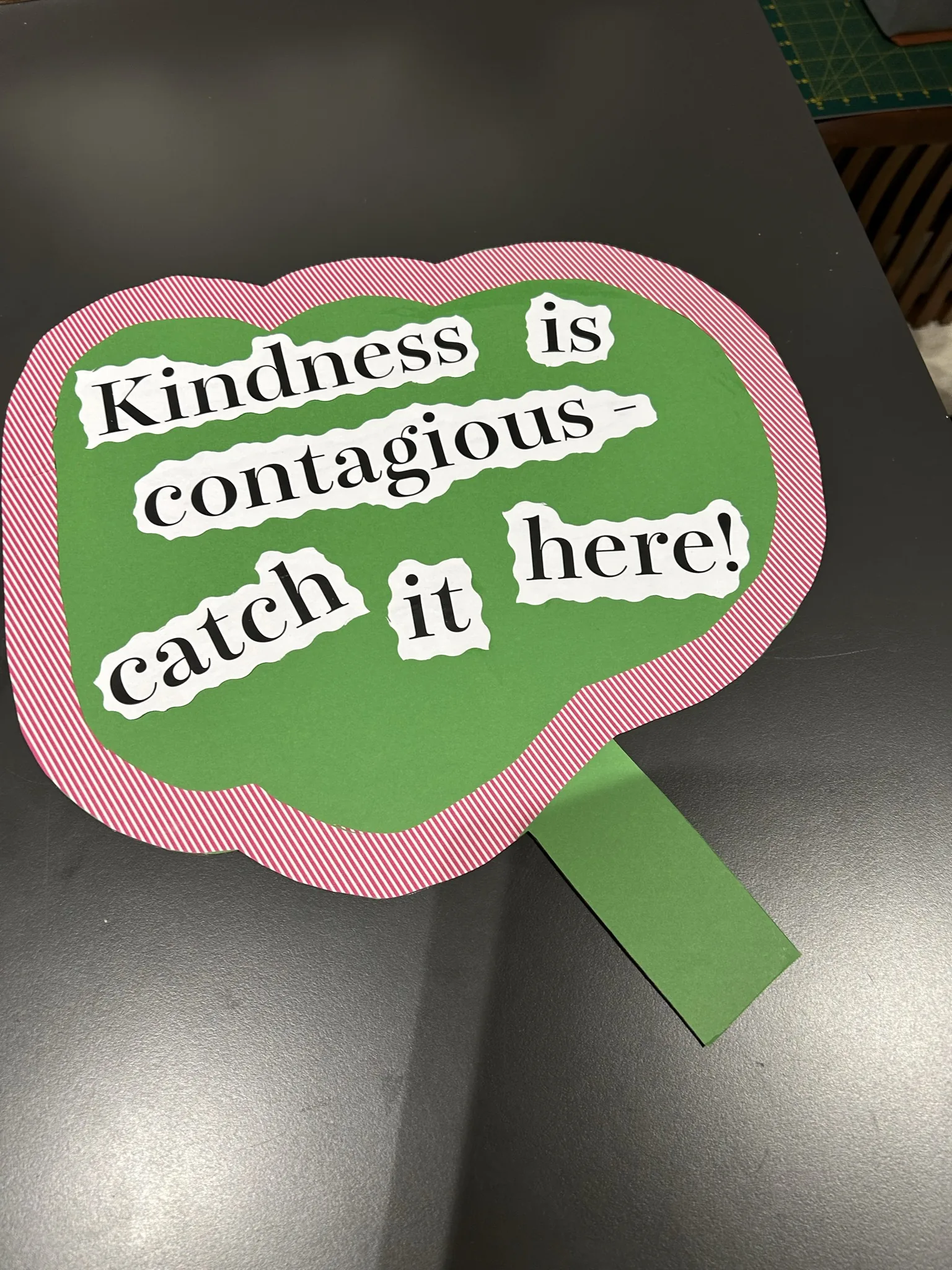 "Kindness is contagious — catch it here!" prop