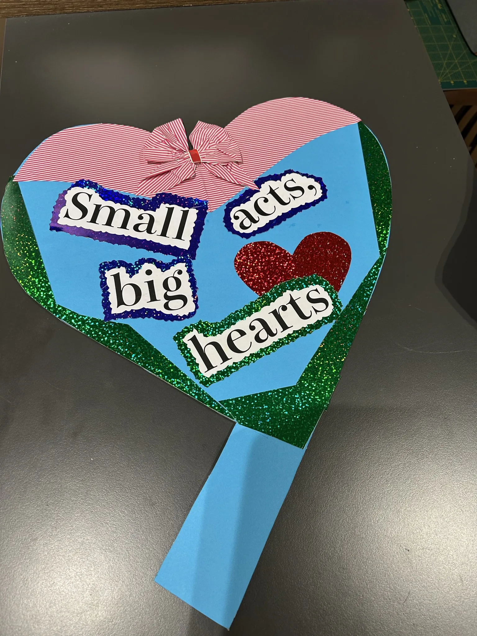 "Small acts, big hearts" glitter heart prop